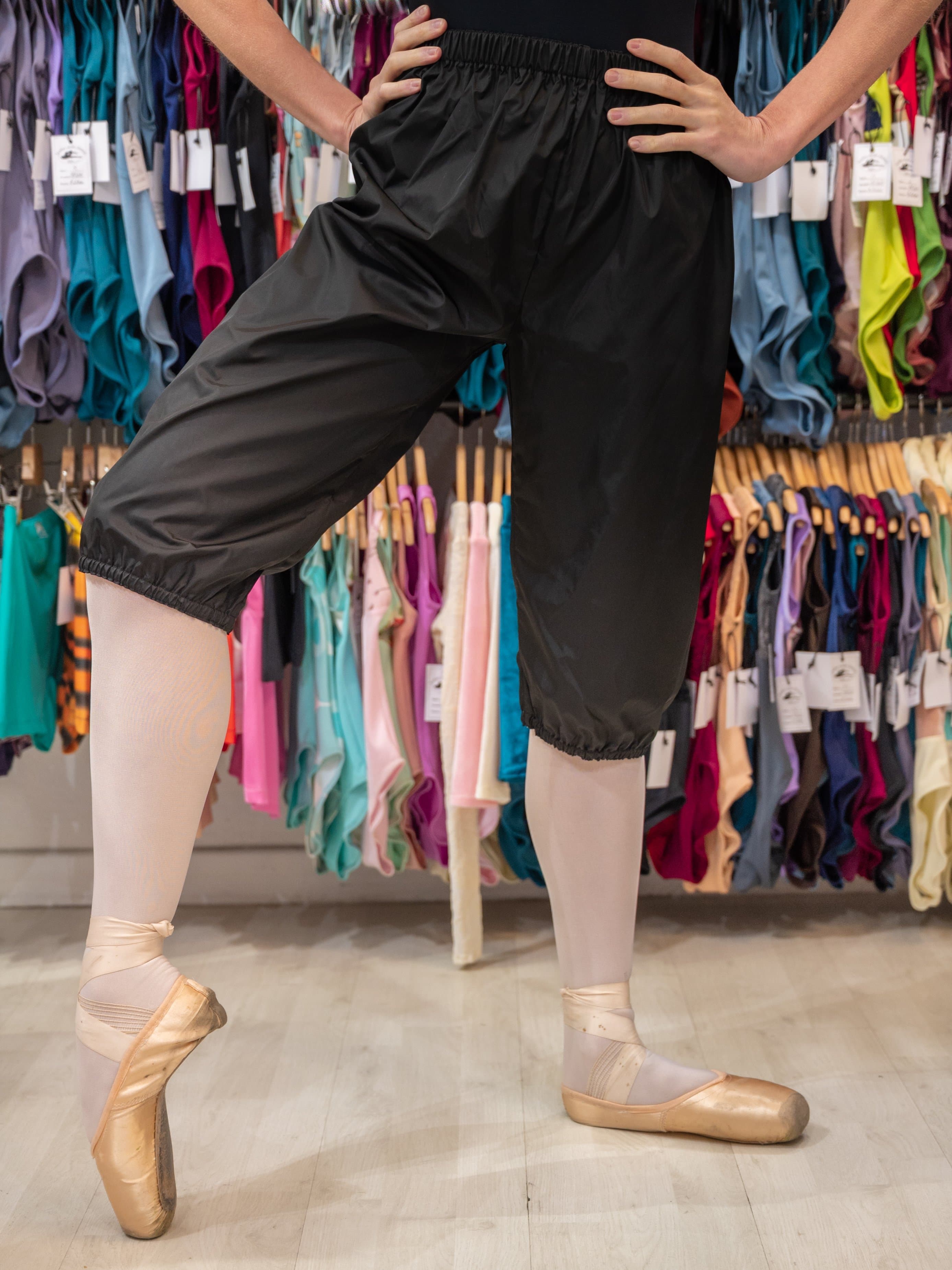 https://www.atelierdelladanzamp.com/cdn/shop/products/black-warm-up-dance-trash-bag-pants-mp5004-for-women-and-men-by-atelier-della-danza-mp-1.jpg?v=1707843888